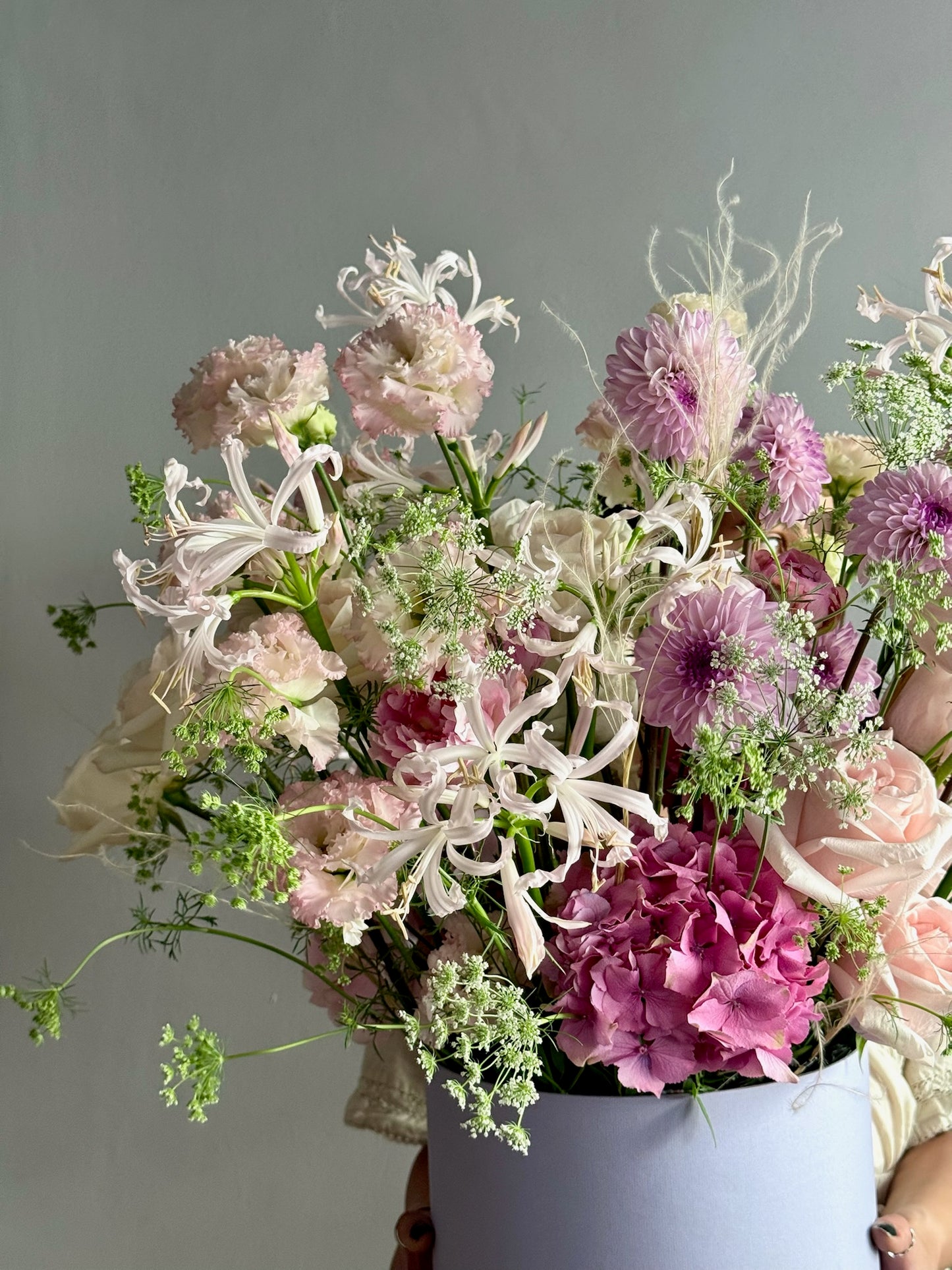 Bouquet of flowers in a vase against a gray background