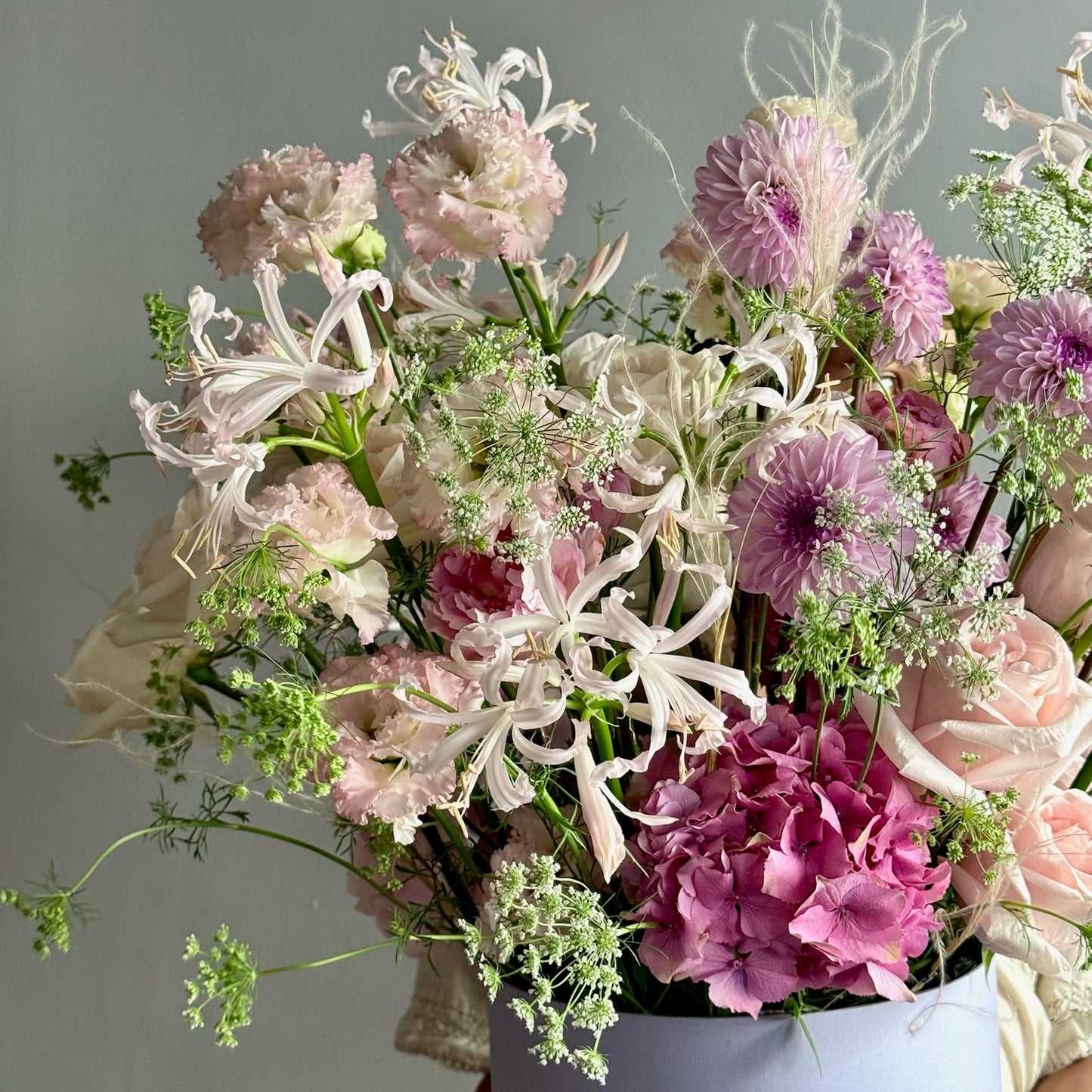 Bouquet of flowers in a vase against a gray background