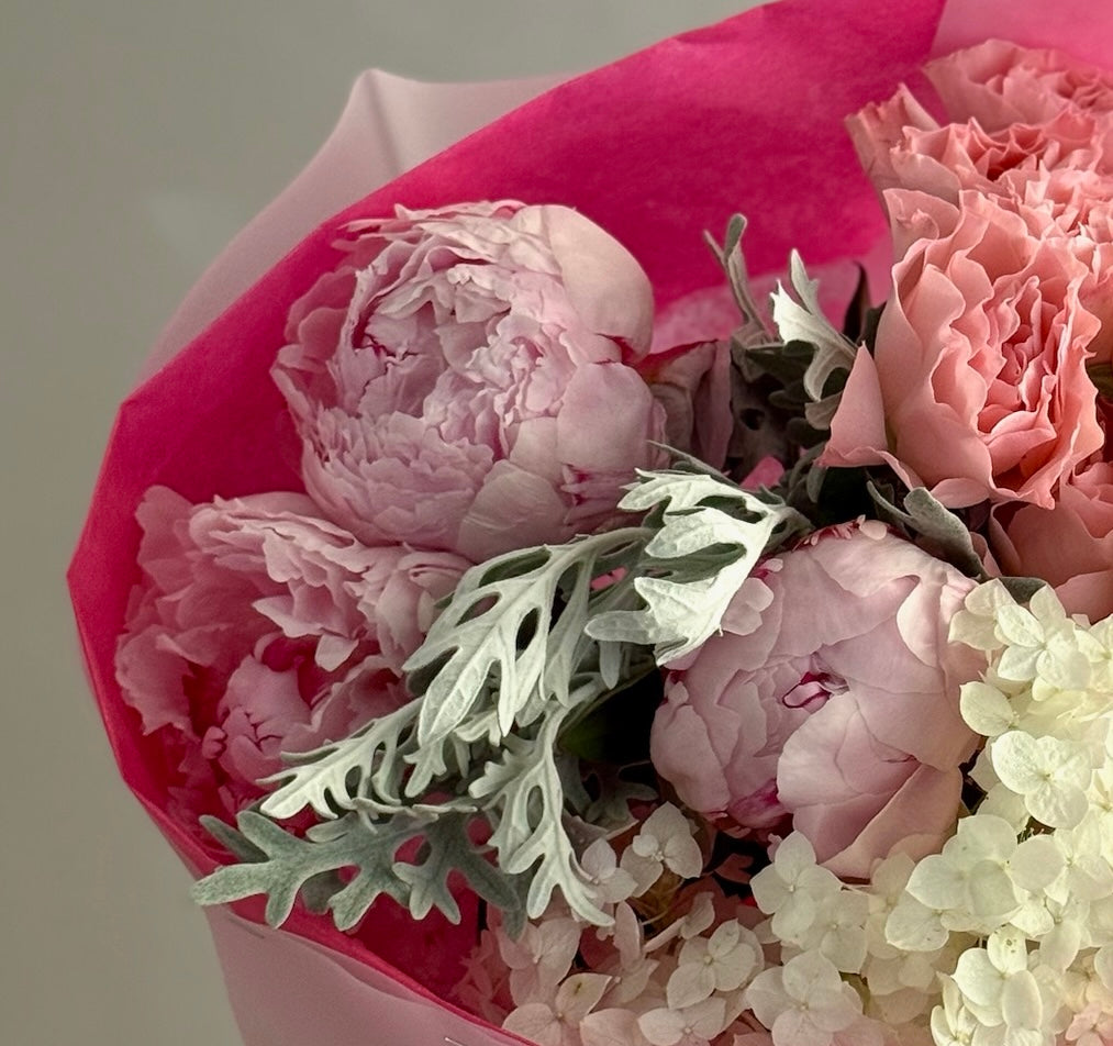 Pink peonies with grenery