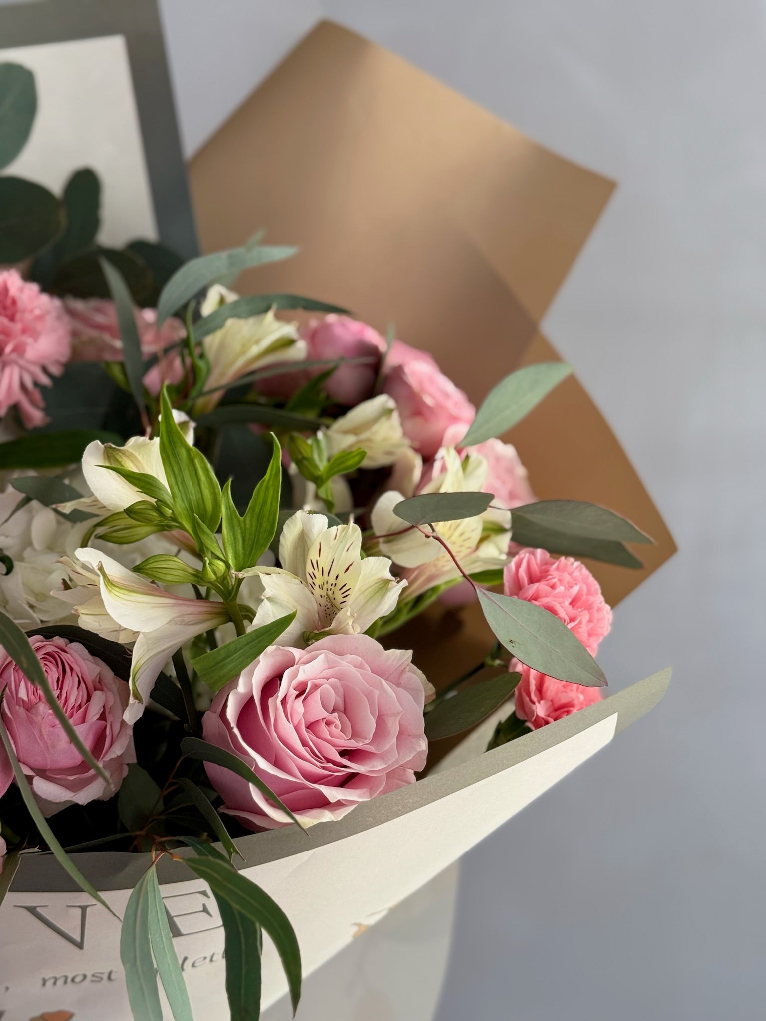 Closeup of flowers in a bouqet on grey background 