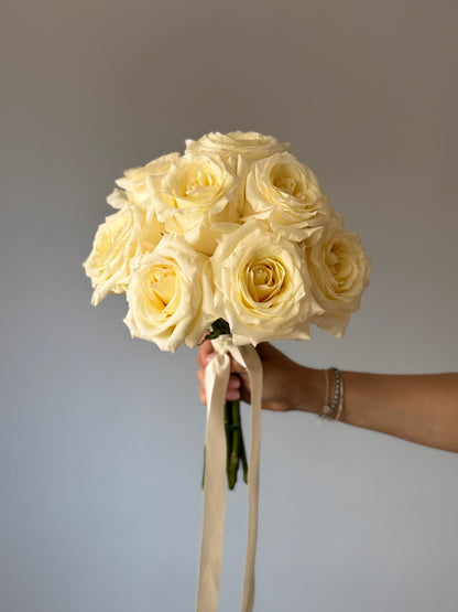 Bridal bouquet with white flowers on grey background 