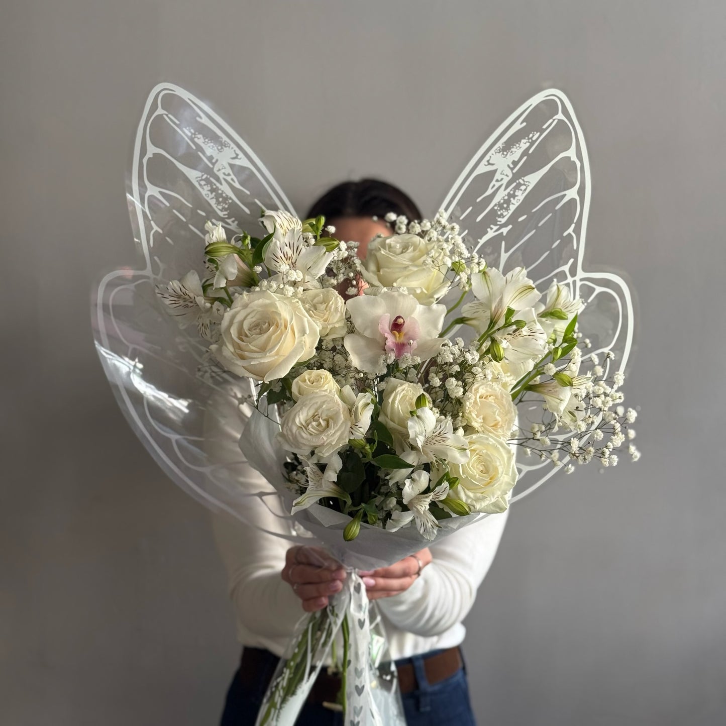 White butterfly bouquet with white flowers and butterfly wrapping paper