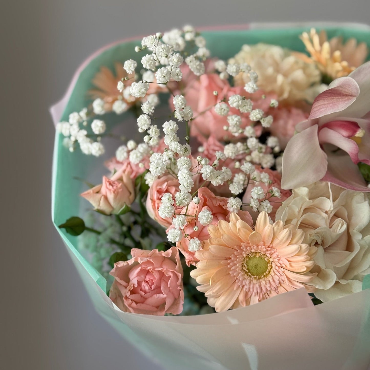 Pink and white flowers in bouquet