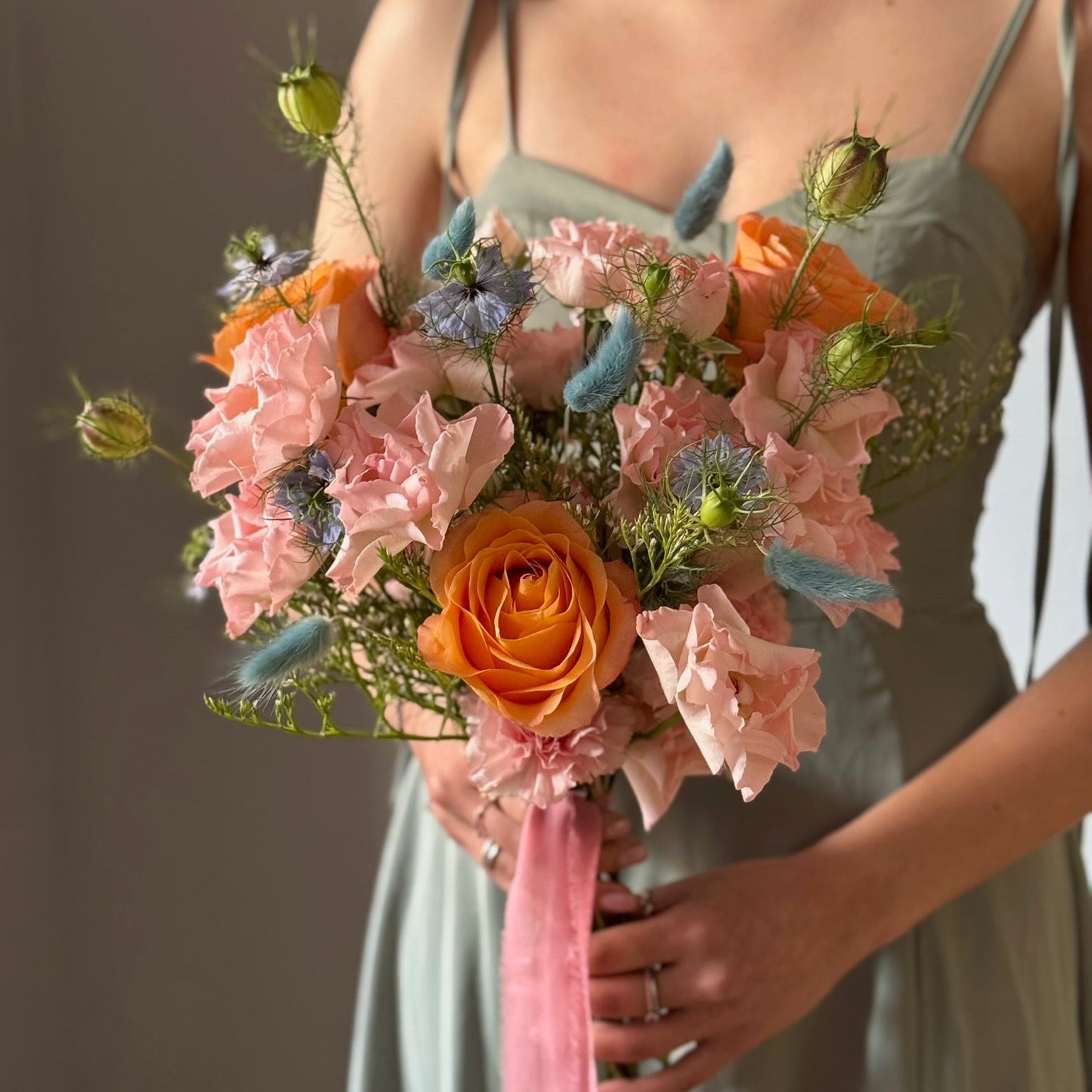 Colorful bouquet held by person