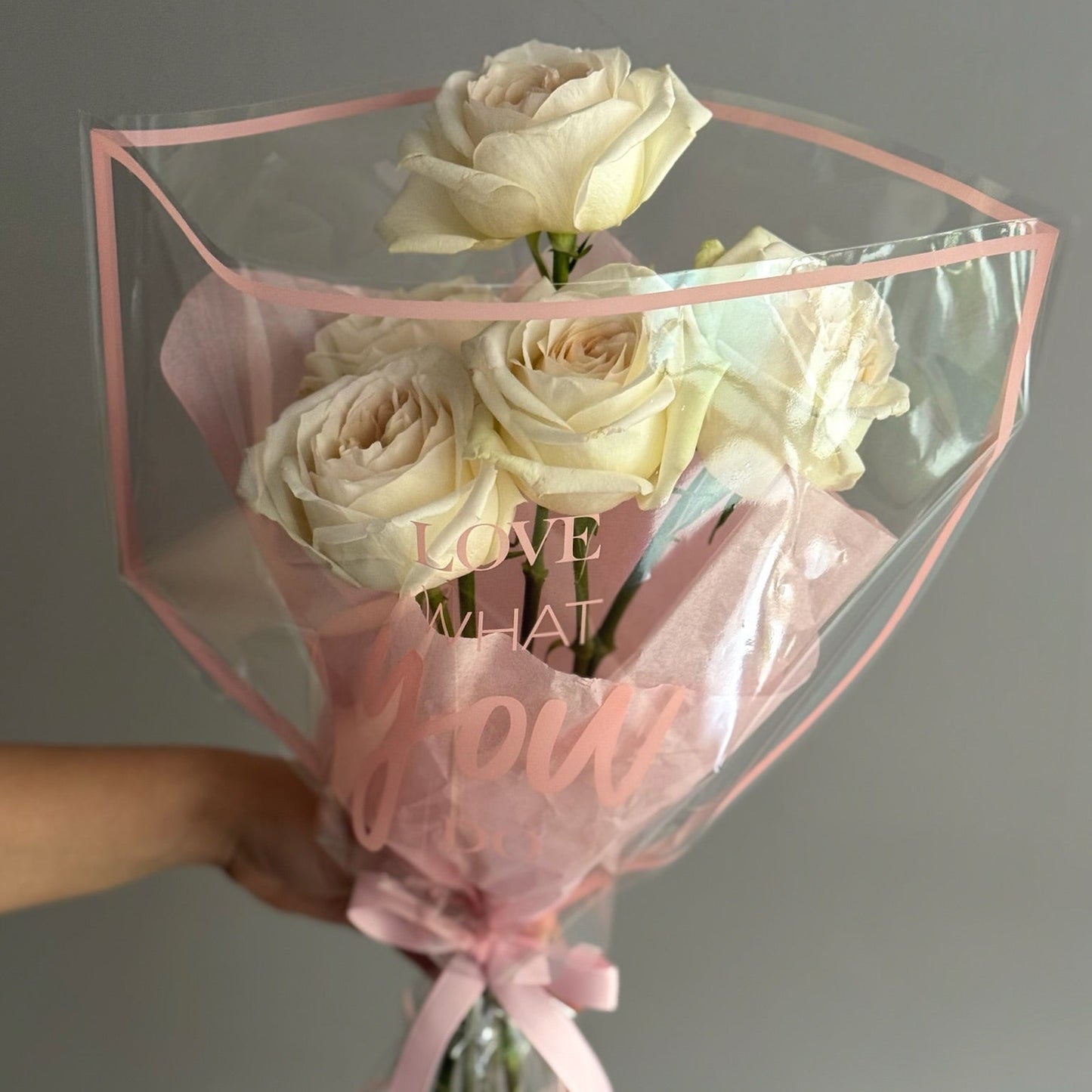White roses on grey background