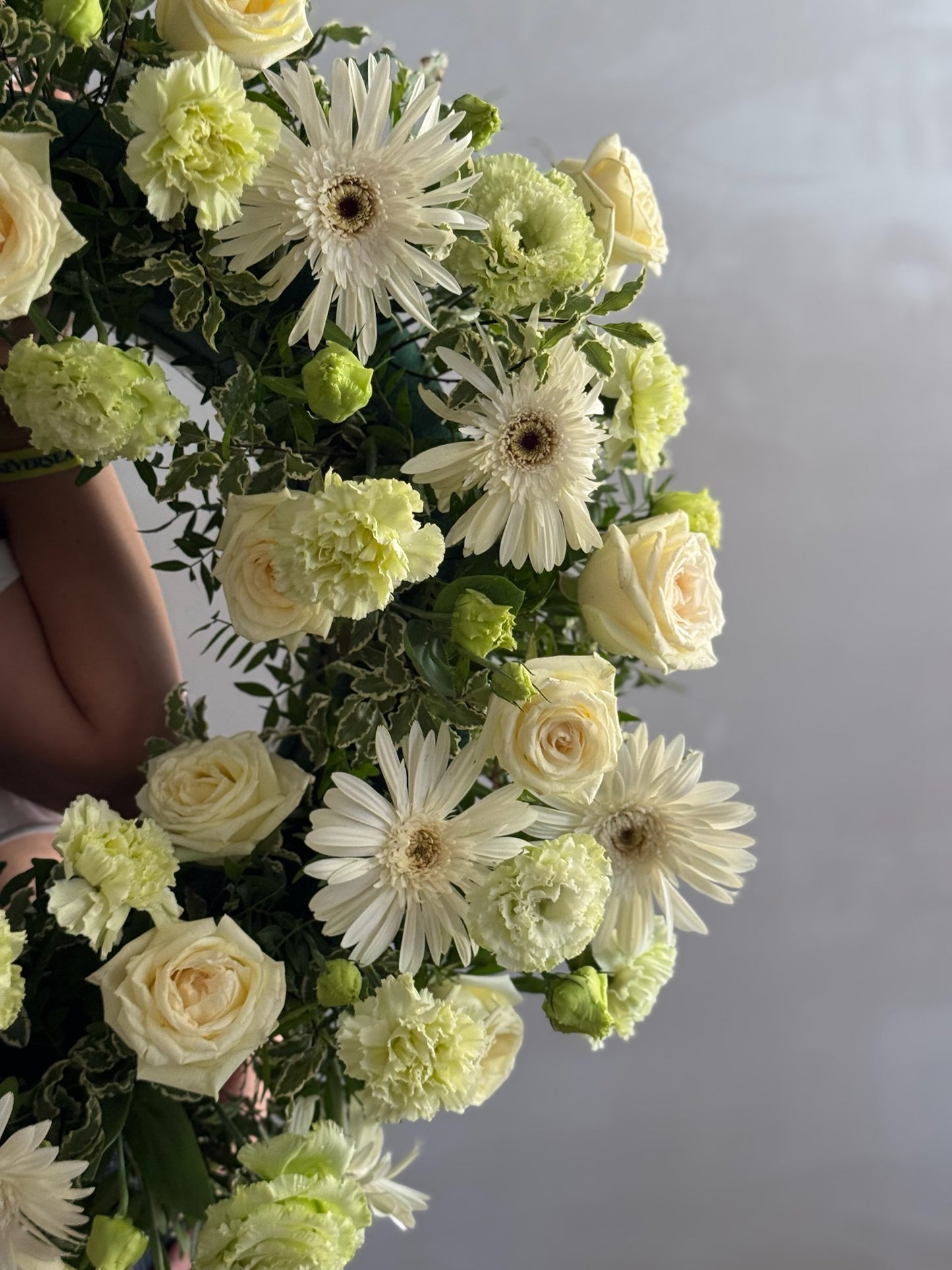 Bouquet of white and green flowers with a blurred background