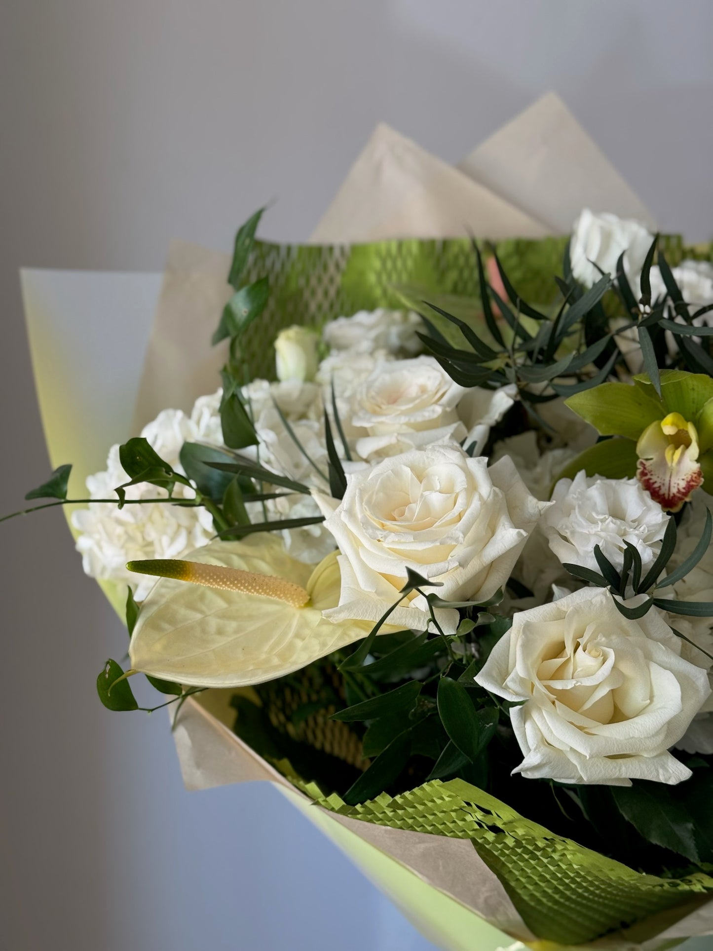 Closeup of bouquet with withe and green flowers